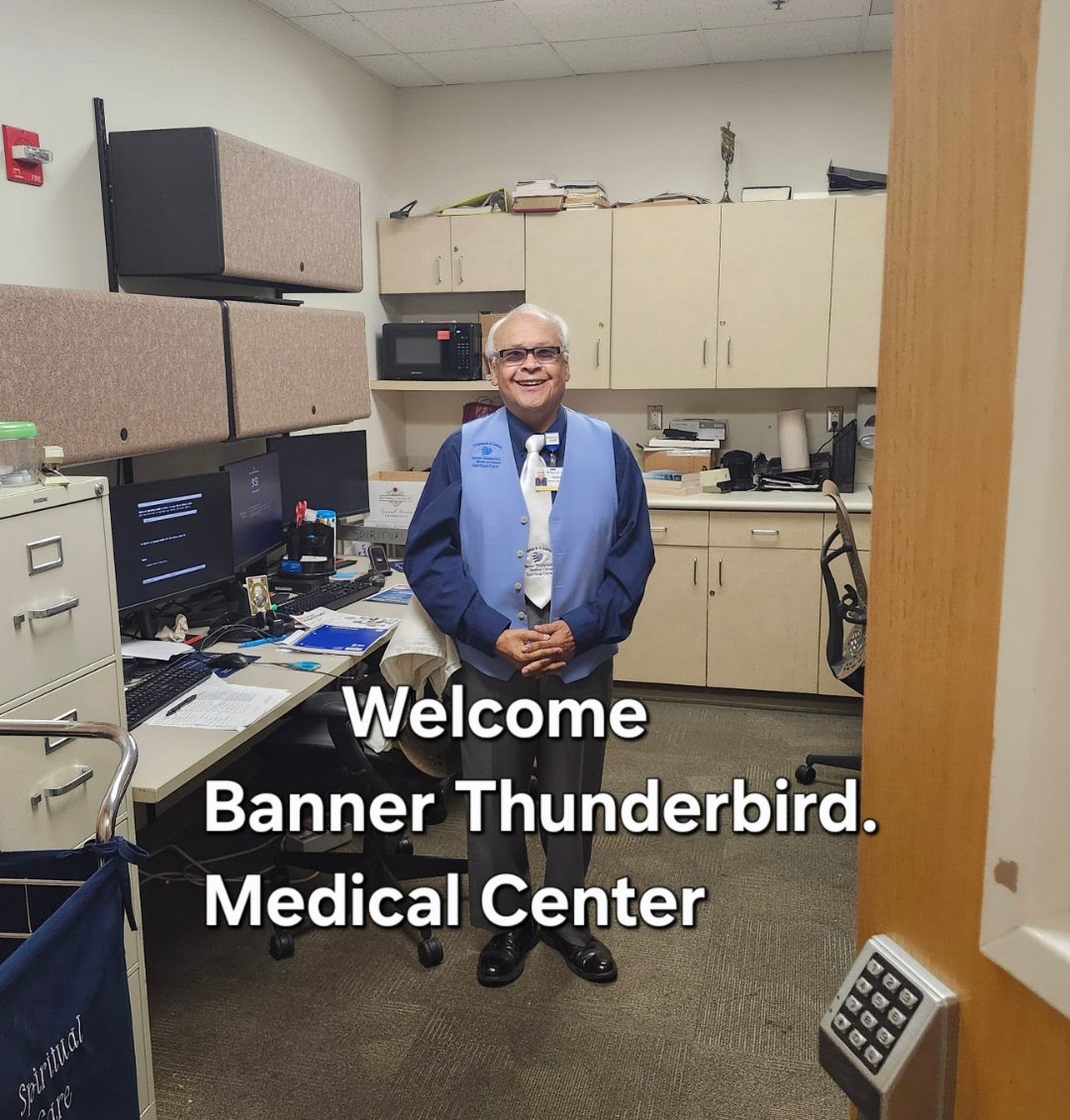 Chaplain Mannie Gomez welcoming visitors from his office at Banner Thunderbird
